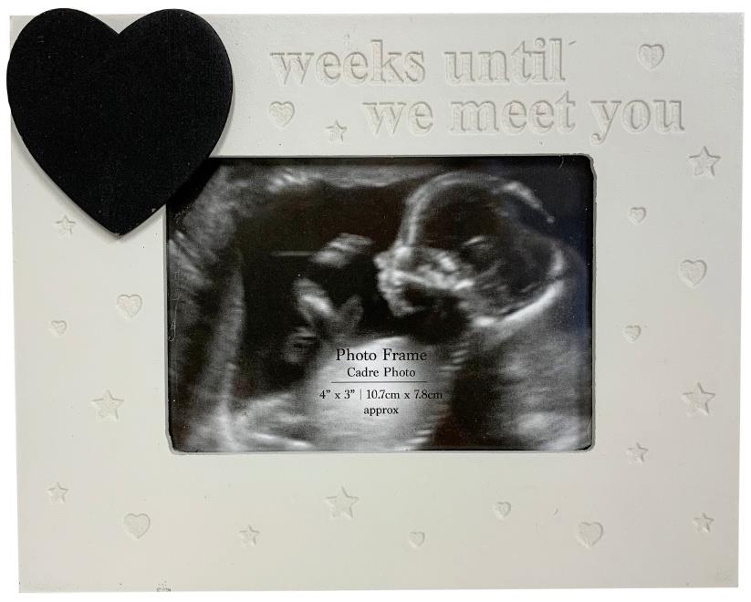 Baby scan frame with heart chalkboard.