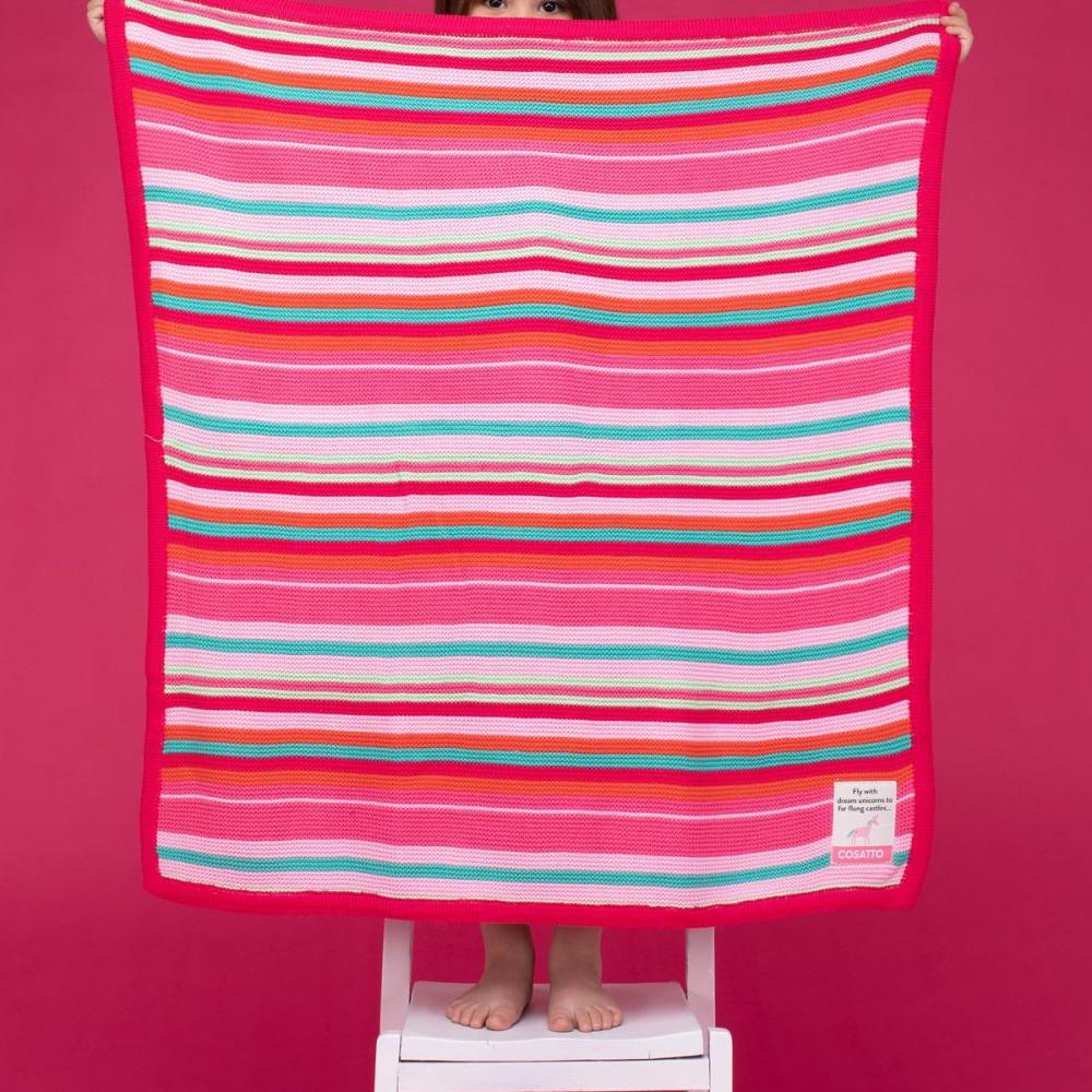 A large bright colourful baby blanket.  This baby blanket is striped in various colours of pink.