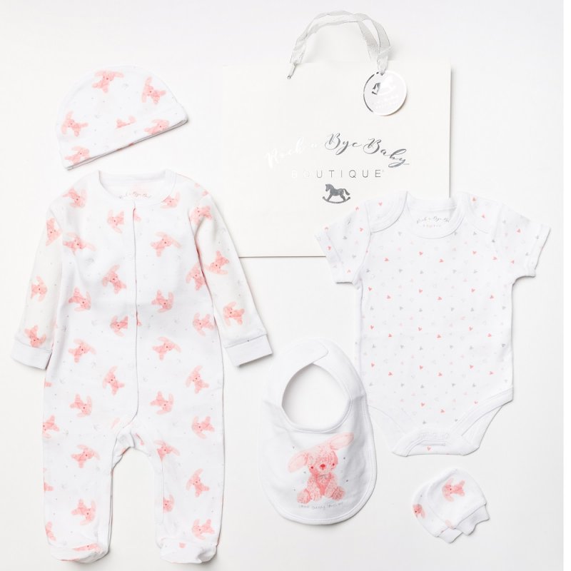 A baby girl 5 piece clothing gift set which is white with pink bunny print and a large bunny printed on the bib.