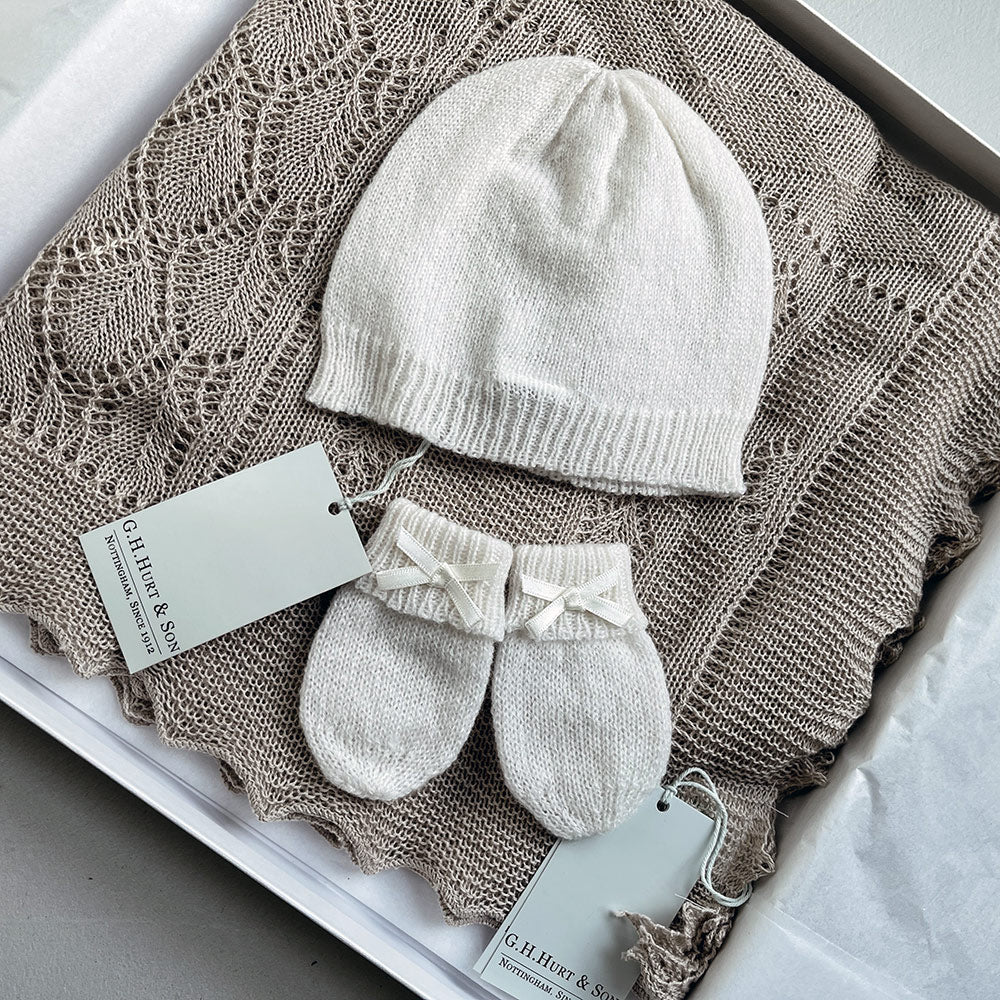 Beautiful cashmere white knitted hat and mitten set.  The perfect gift for a new baby