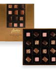 16 sea salt caramel chocolate selection with no alcohol beautifully presented in a gold box.