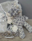 Baby hamper gift with giraffe soft toy, baby clothing set and chocolates for the parents.