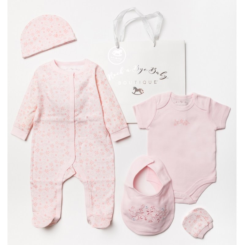 Soft pink 5 piece clothing gift set for baby girl.  The baby grow has flower print and the bib has embroidered flowers.