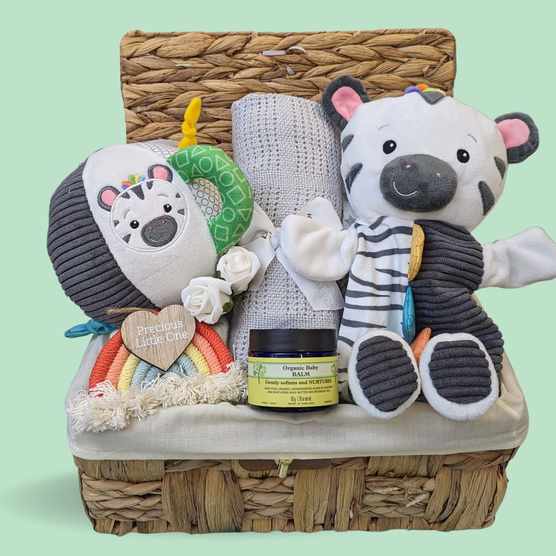 Baby gift hamper packed with toys and gifts for a new baby.