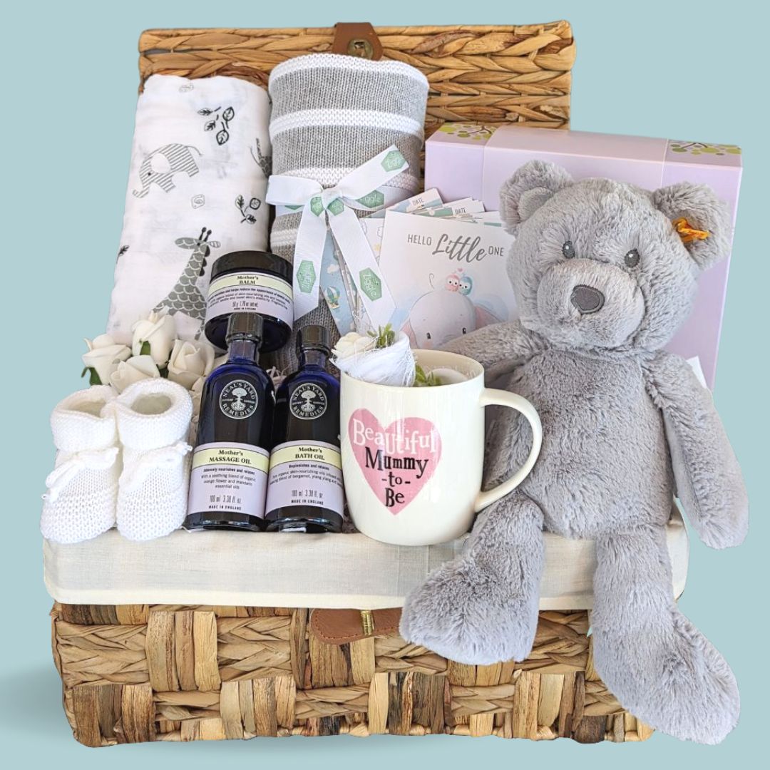 Mum to be pamper hamper with baby blanket wrap and pamper products for Mum.