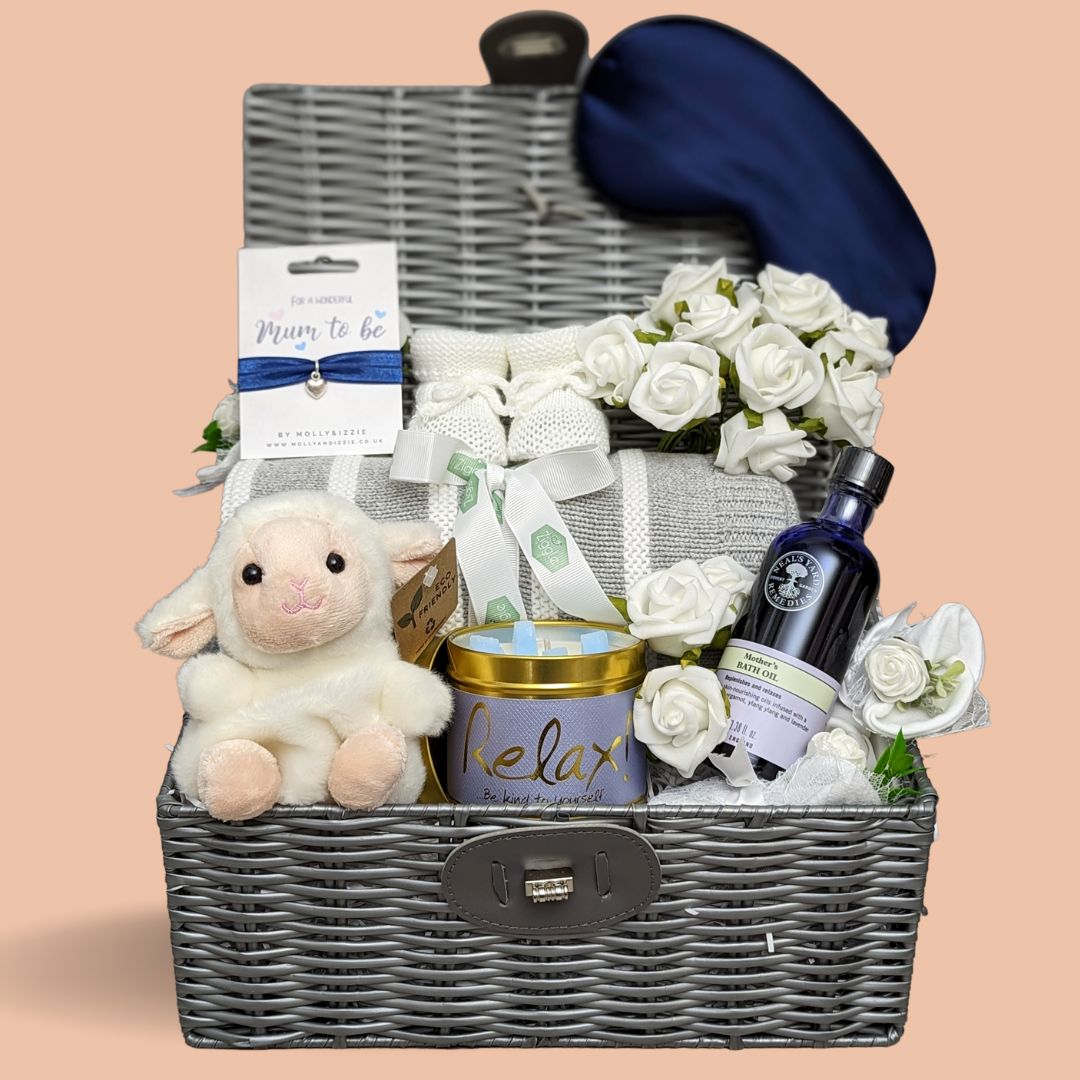 Mum to be gift hamper with skincare, cnadle, bracelet, blanket & baby toy.