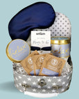 Mum to be hamper trunk with candle, bracelet, eye mask and treat for mum.