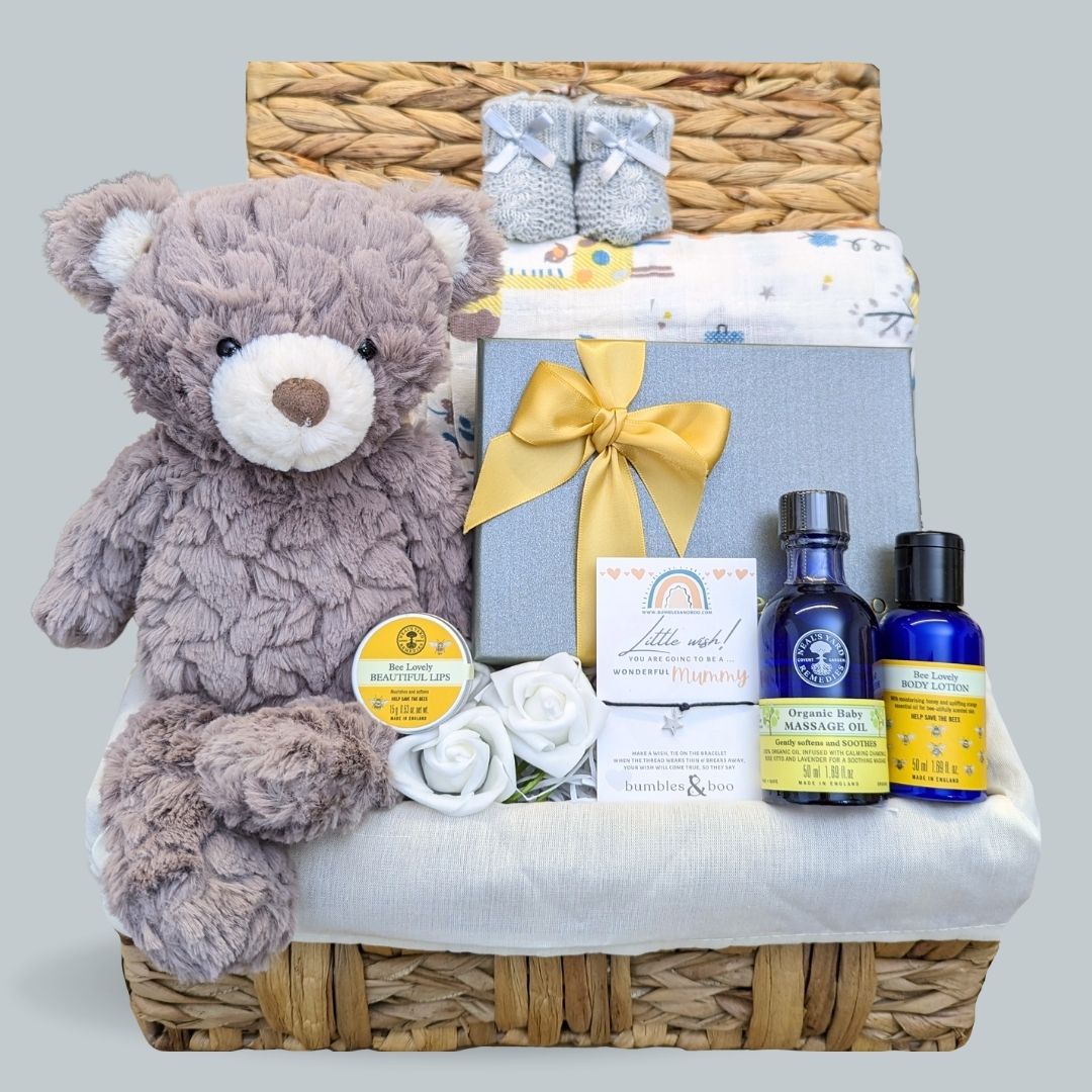mum to be hamper gifts basket with pamper gifts for mum plus a teddy bear, muslin wrap and booties for baby.