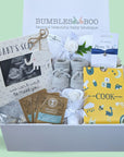 mum to be gift box with dinner vouchers, baby scan frame, baby booties, blanket, bracelet and baby mittens.