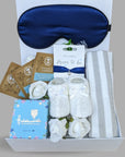 Pregnancy hamper with treats for Mum. Includes bracelet for Mum, baby booties, chocolates and skincare.