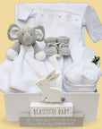 baby hamper gift in white and grey with teddy romper and elephant comforter
