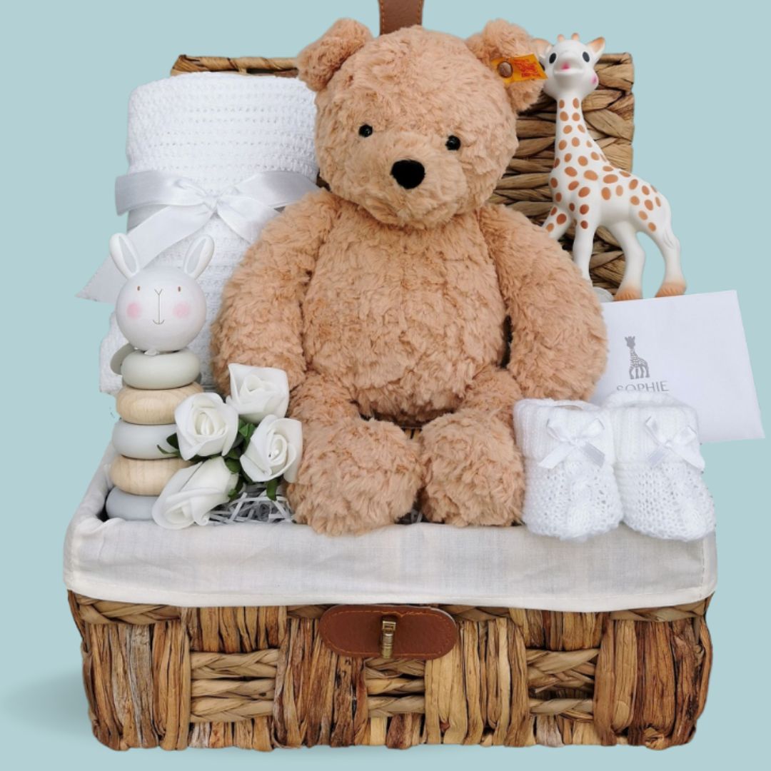 new baby gift basket with steiff teddy bear, sophie la giraffe teething toy and cellular baby blanket.