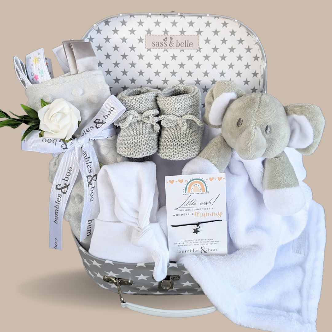 new mum hamper gifts with elephant comforter, baby booties, baby blanket and baby hat.