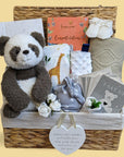 New mum hamper basket with panda bear soft toy, baby journal and milestone cards, baby blanket, baby hat and sensory taggie blanket.