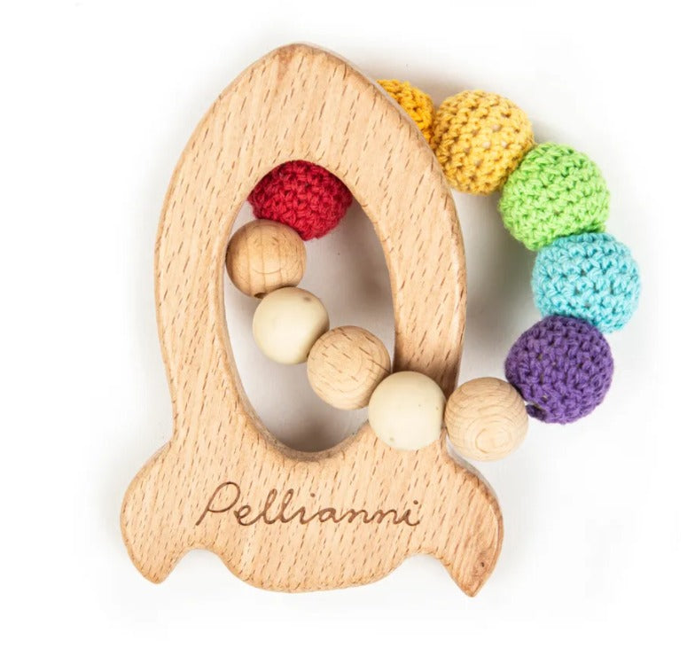A colourful wooden baby teether shaped like a rocket with soft chewable beads.