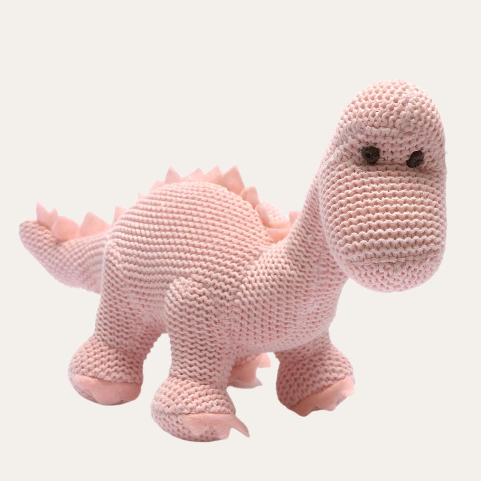 Pink dinosaur baby rattle made from knitted organic cotton in the shape of a diplodocus dinosaur