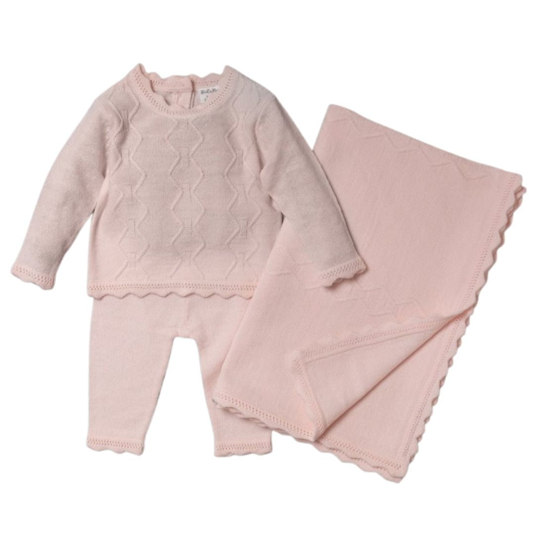 Pink baby girl clothing set with jumper, trousers and a blanket.