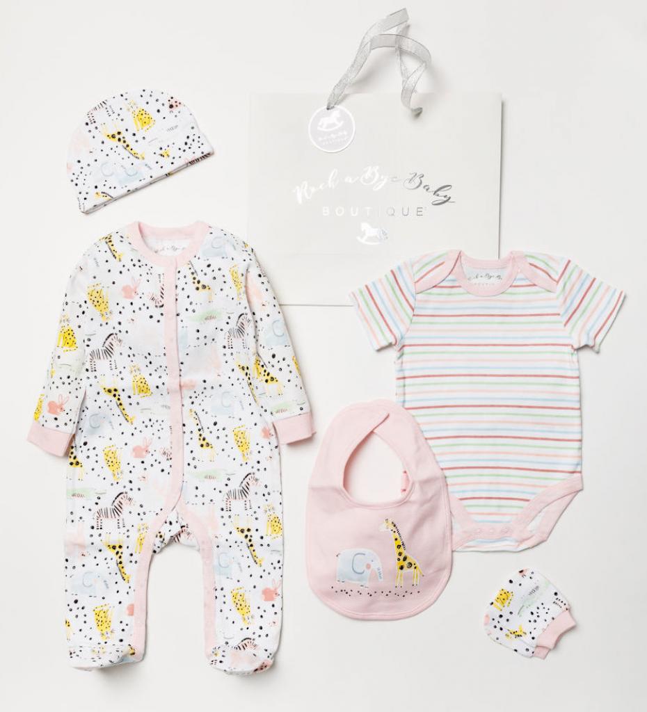Safari theme baby girl&#39;s layette set in pink. This baby girl&#39;s gift set includes a sleepsuit, bodysuit, bib and beanie hat. The super soft light cotton material makes this a perfect gift for newborns. A gorgeous set for baby girls!