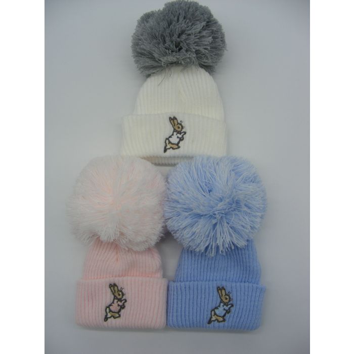 White knitted hat with a grey pom pom.  An embroidered bunny on the knitted turn up