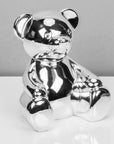 Silver plated teddy money box. with money slot and bung at base.