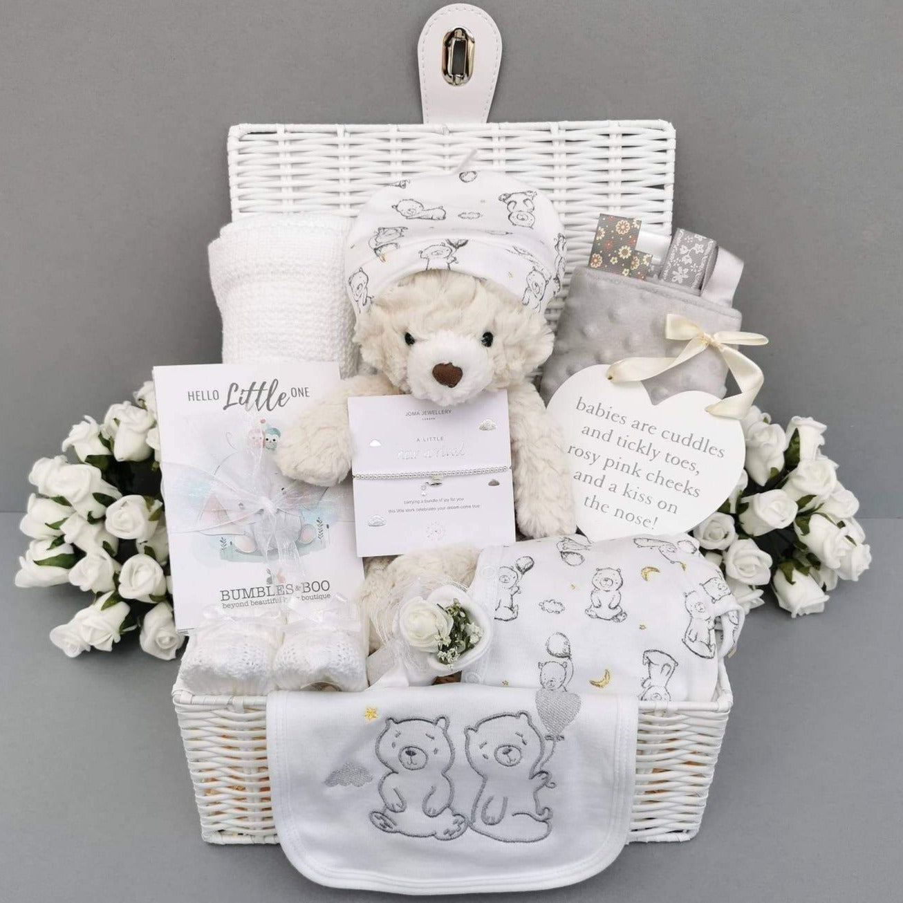 Baby hamper basket with white teddy bear, milestone cards, white cellular blanket and grey taggie blanket. White baby clothes with bear and balloon motif Unisex Baby Hamper - Bumbles and Boo