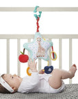 Sophie the Giraffe Star Activities hanging toy in cot with baby.