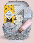Treat box gifts hamper with chocolates, body lotion, bracelet and socks.