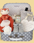 New baby hamper gift with fox comforter, baby booties and taggie sensory blanket.