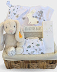 unisex new baby hamper gifts with steiff hoppie bunny, baby clothing set, nursery plaque and organic skincare for baby.